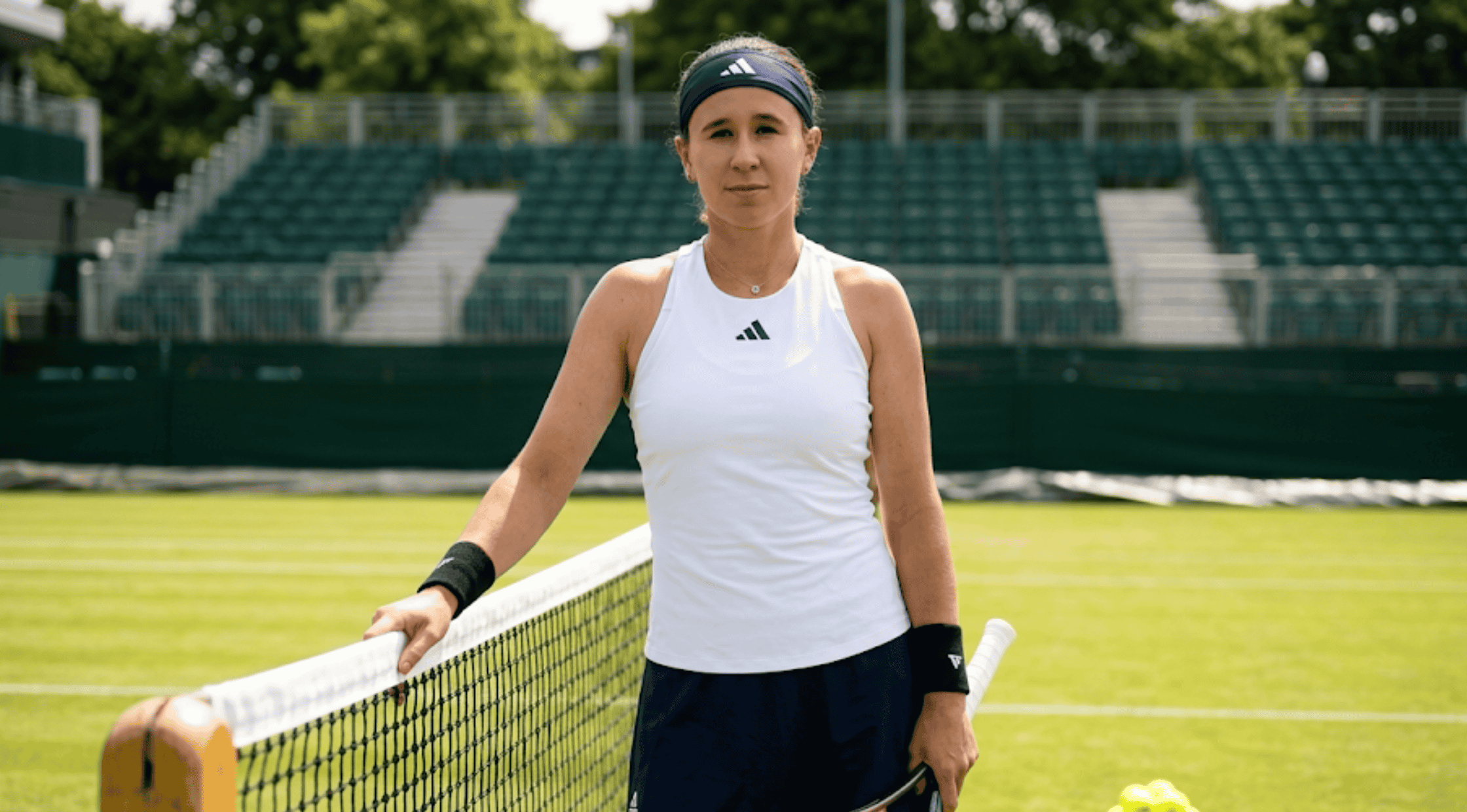 Nikola Bartunkova Berlin Tennis Open 2026 white high-neck sleeveless racerback tennis top with princess seams.